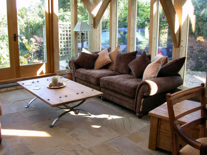 Lounge furniture in a new oak framed garden room.