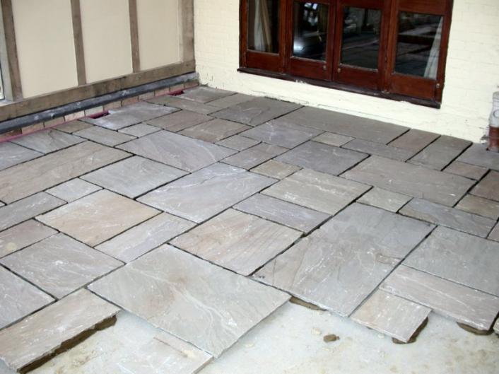 A newly laid stone floor, ready for pointing.