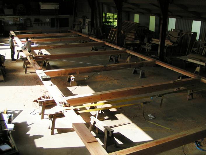 A Douglas fir frame, laid out in the carpentry yard.