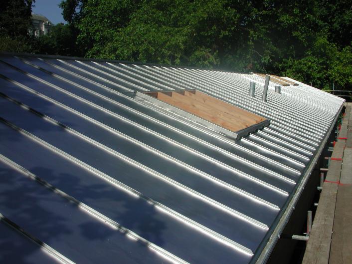 A roof finished with stainless steel standing seem covering.