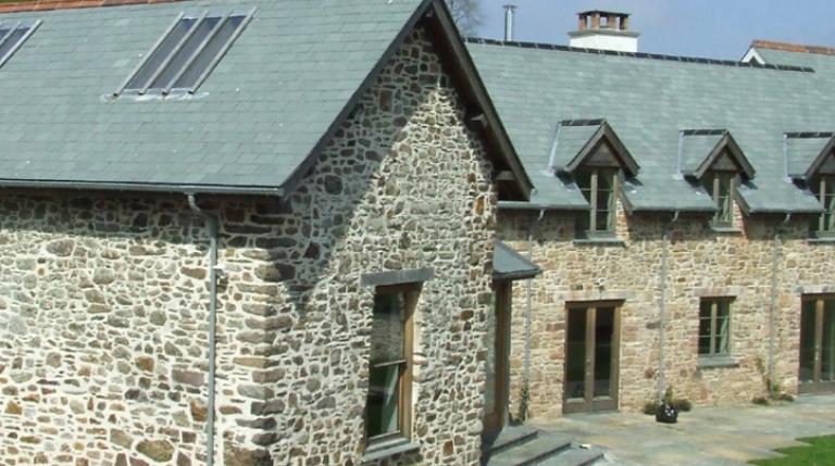 Stone barns that have been converted into a family home.