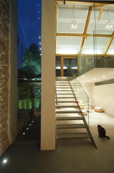 Glass and steel staircase in a modern barn conversion.