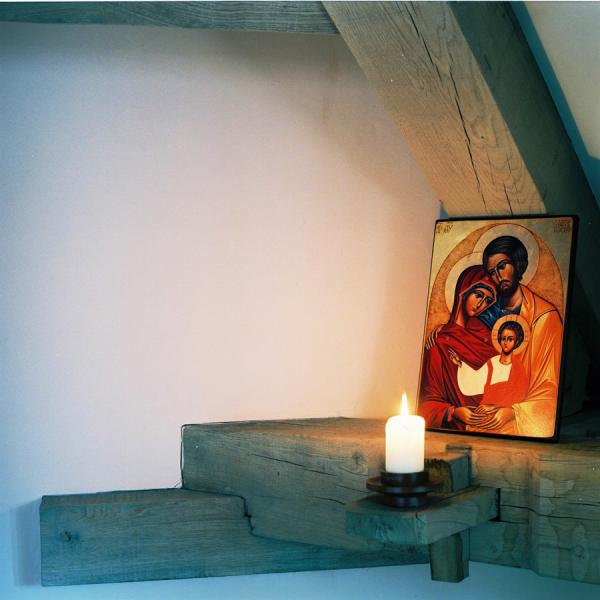 An icon on an oak frame, with candle.