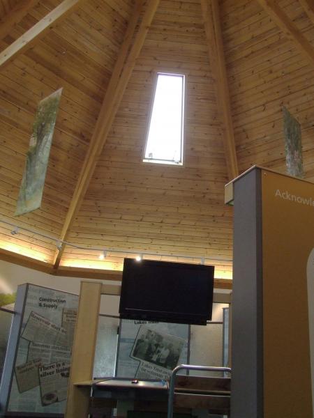 An exhibition inside a timber framed building.