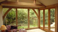 Oak framed extension with direct glazing and lantern.