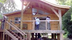 Cabin style eco-house built on greenheart stilts.