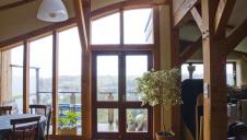 A feature window within the living space of a timber framed straw bale house.