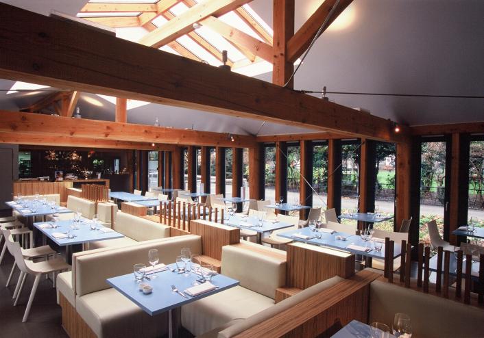 The inside of a restaurant with a structural Douglas fir feature frame.
