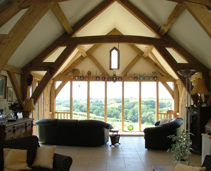 The view from the living room of an upside down, oak framed house.