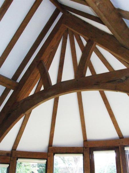 Central arch brace truss in a curved extension.